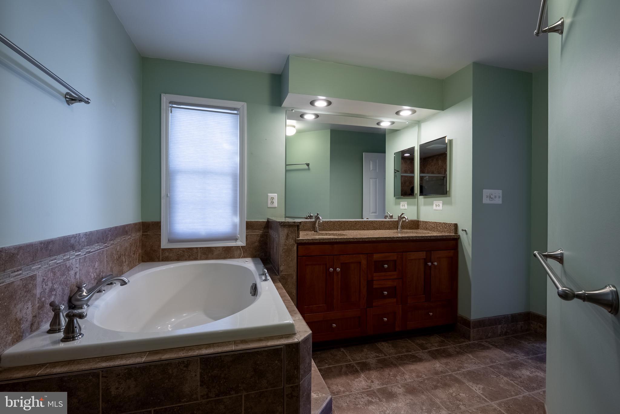 8007 Craddock Road Greenbelt, MD 20770 - Photo 27 of 59 Serene bathroom retreat with modern finishes.