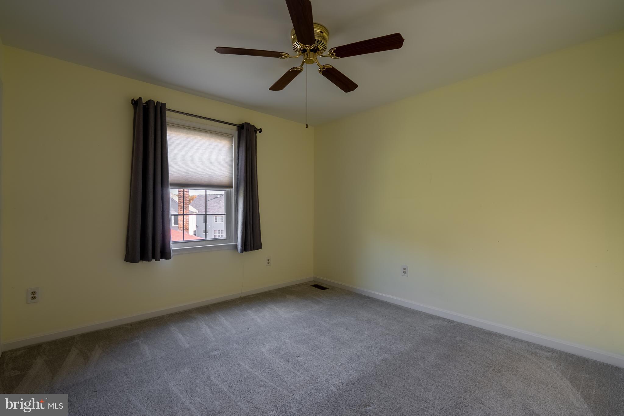 8007 Craddock Road Greenbelt, MD 20770 - Photo 33 of 59 Bright and airy room with soft yellow walls.