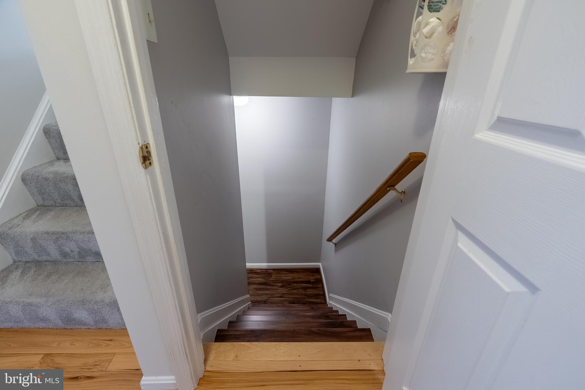 8007 Craddock Road Greenbelt, MD 20770 - Photo 35 of 59 Inviting staircase with warm wooden accents.