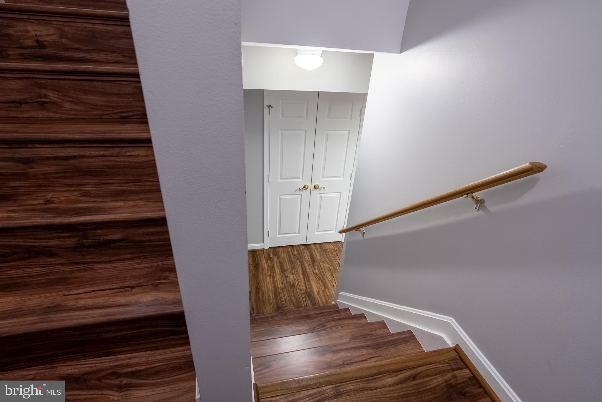 8007 Craddock Road Greenbelt, MD 20770 - Photo 36 of 59 Inviting staircase leading to bright hallway.