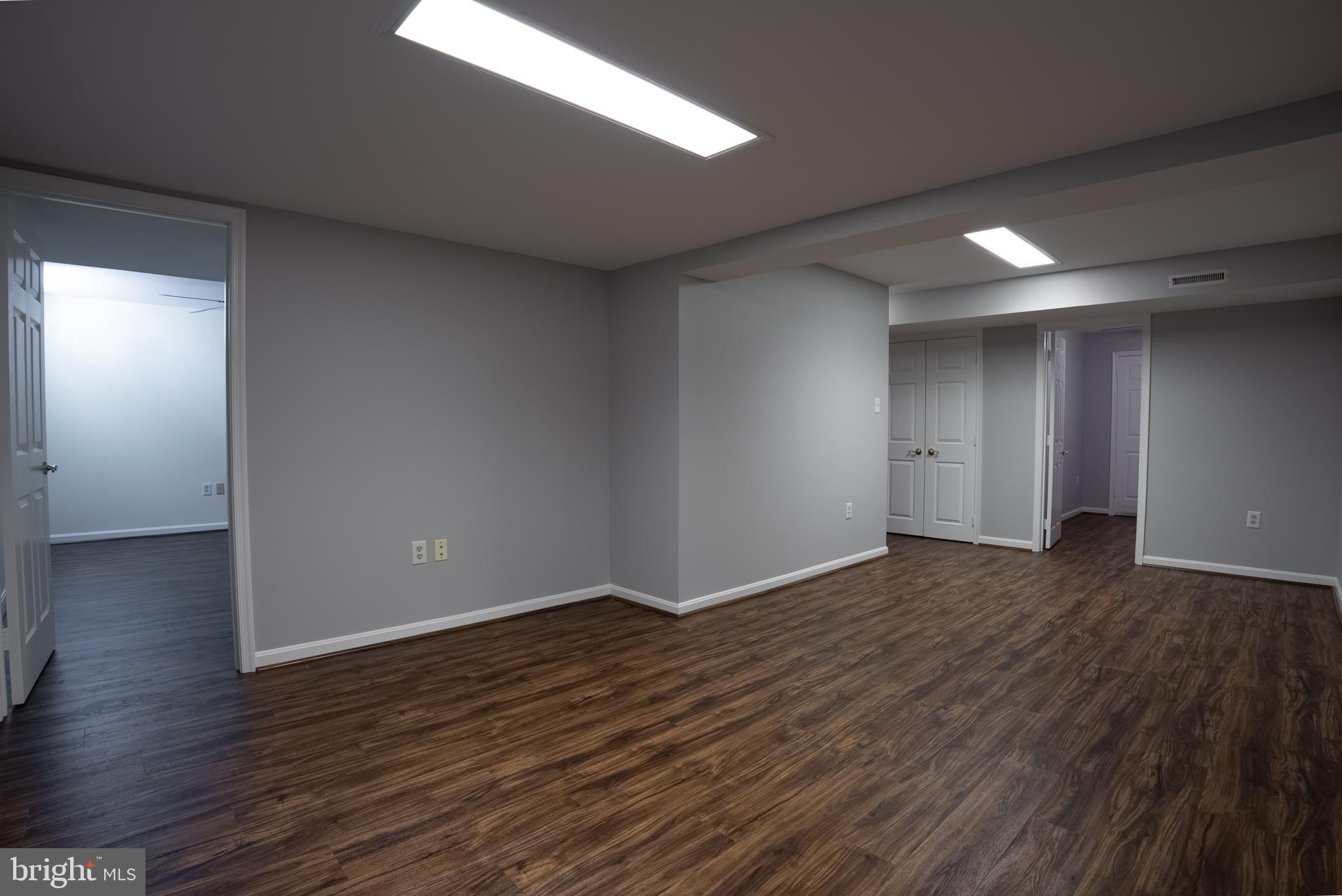 8007 Craddock Road Greenbelt, MD 20770 - Photo 38 of 59 Spacious, modern interior with warm tones.