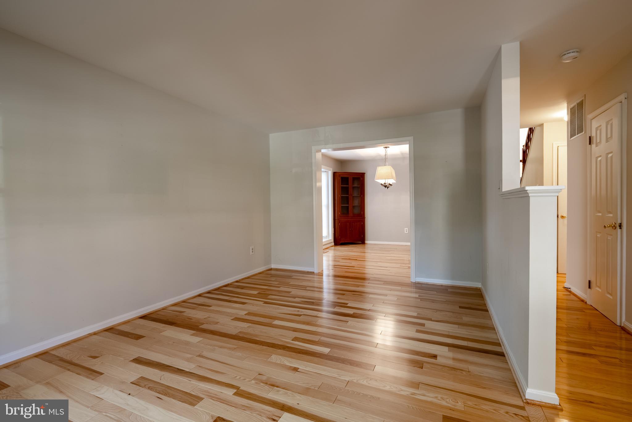 8007 Craddock Road Greenbelt, MD 20770 - Photo 4 of 59 Spacious, sunlit living area with hardwood floors.