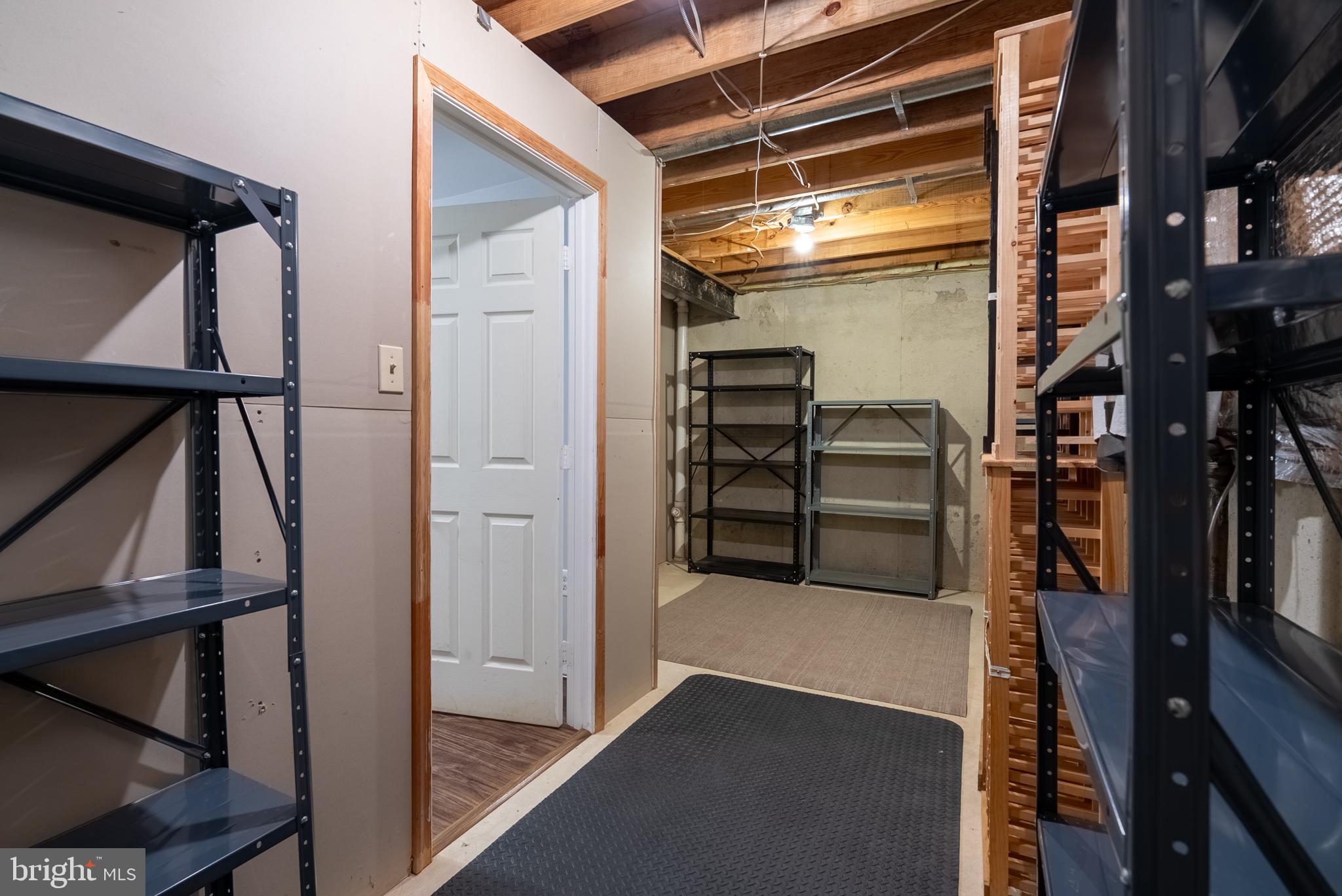 8007 Craddock Road Greenbelt, MD 20770 - Photo 43 of 59 Spacious storage area with shelving units.