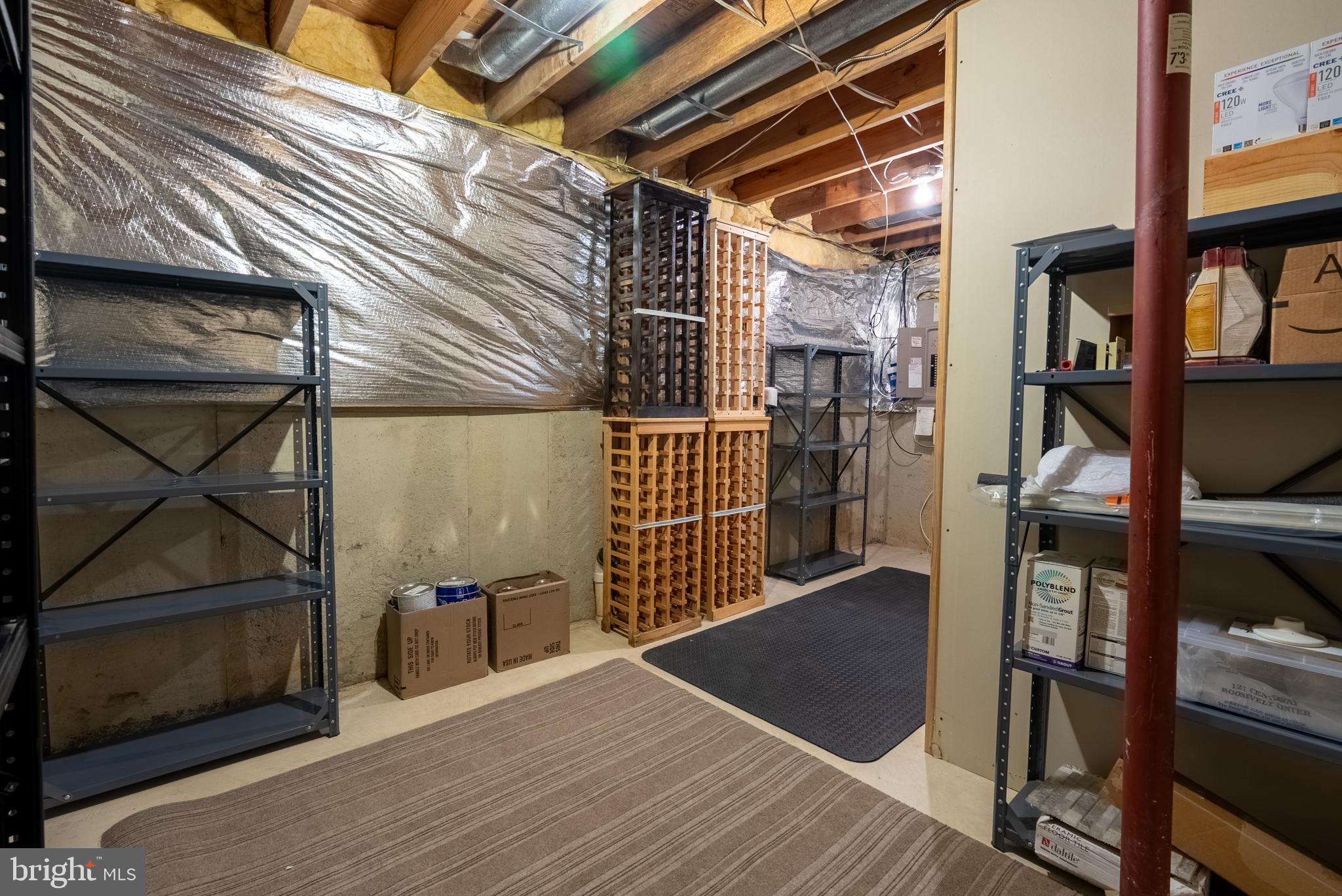 8007 Craddock Road Greenbelt, MD 20770 - Photo 44 of 59 Spacious basement storage area with shelving.