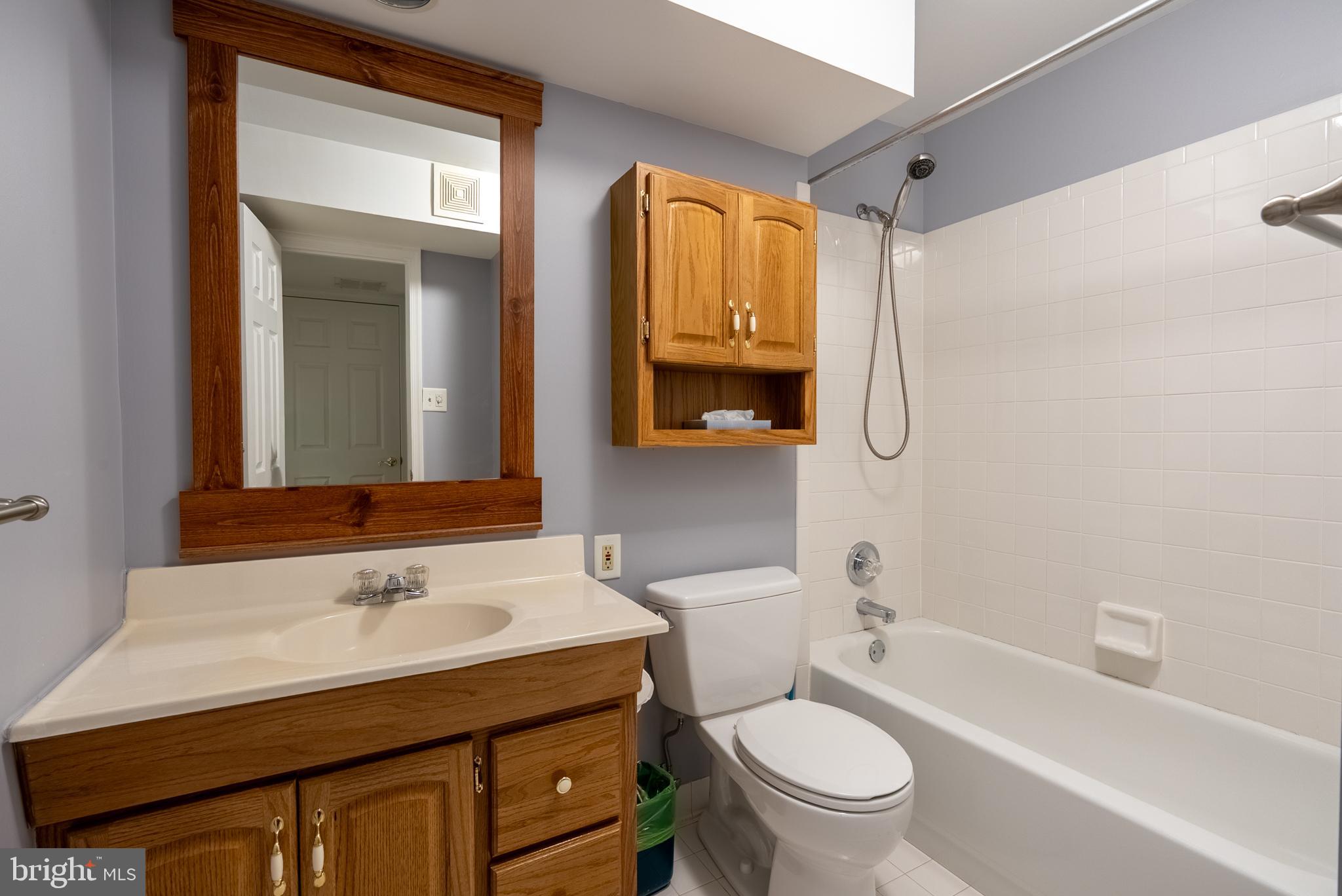 8007 Craddock Road Greenbelt, MD 20770 - Photo 46 of 59 Charming bathroom with classic wooden accents.