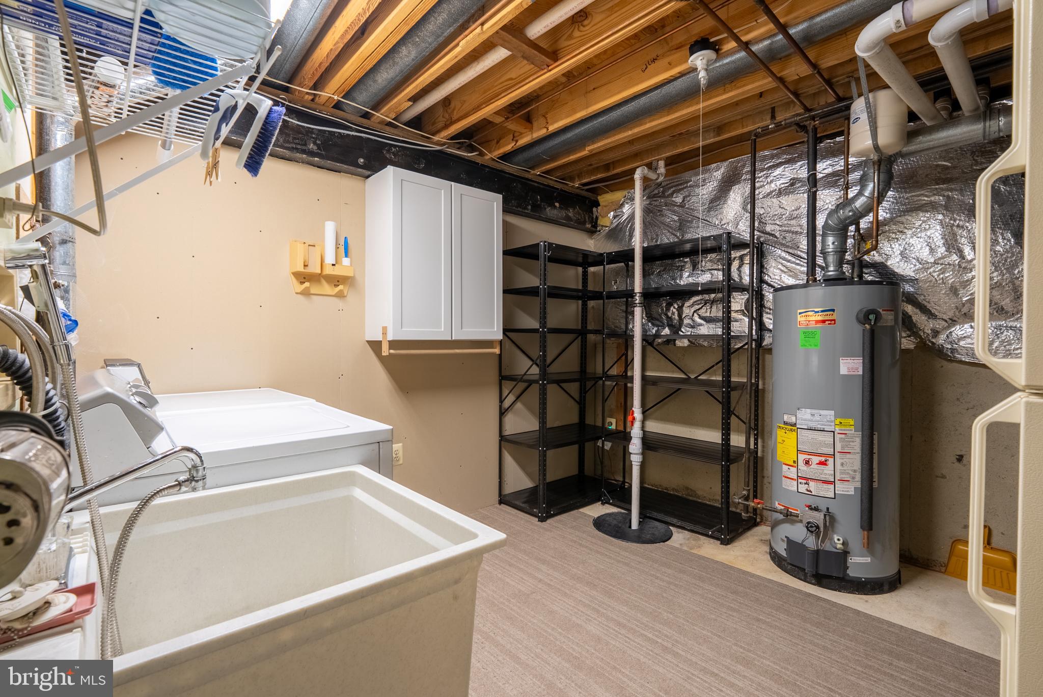 8007 Craddock Road Greenbelt, MD 20770 - Photo 48 of 59 Functional laundry space with ample storage.