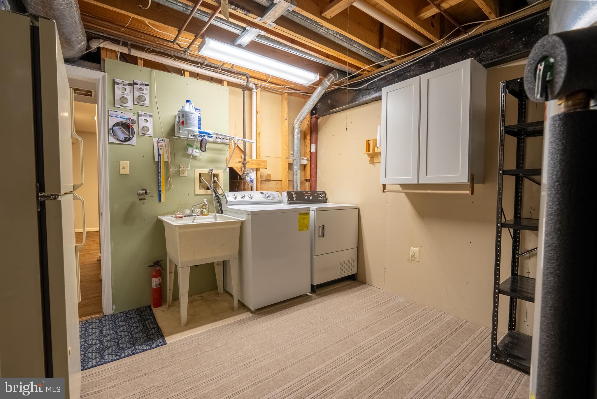 8007 Craddock Road Greenbelt, MD 20770 - Photo 49 of 59 Spacious laundry area with modern appliances.