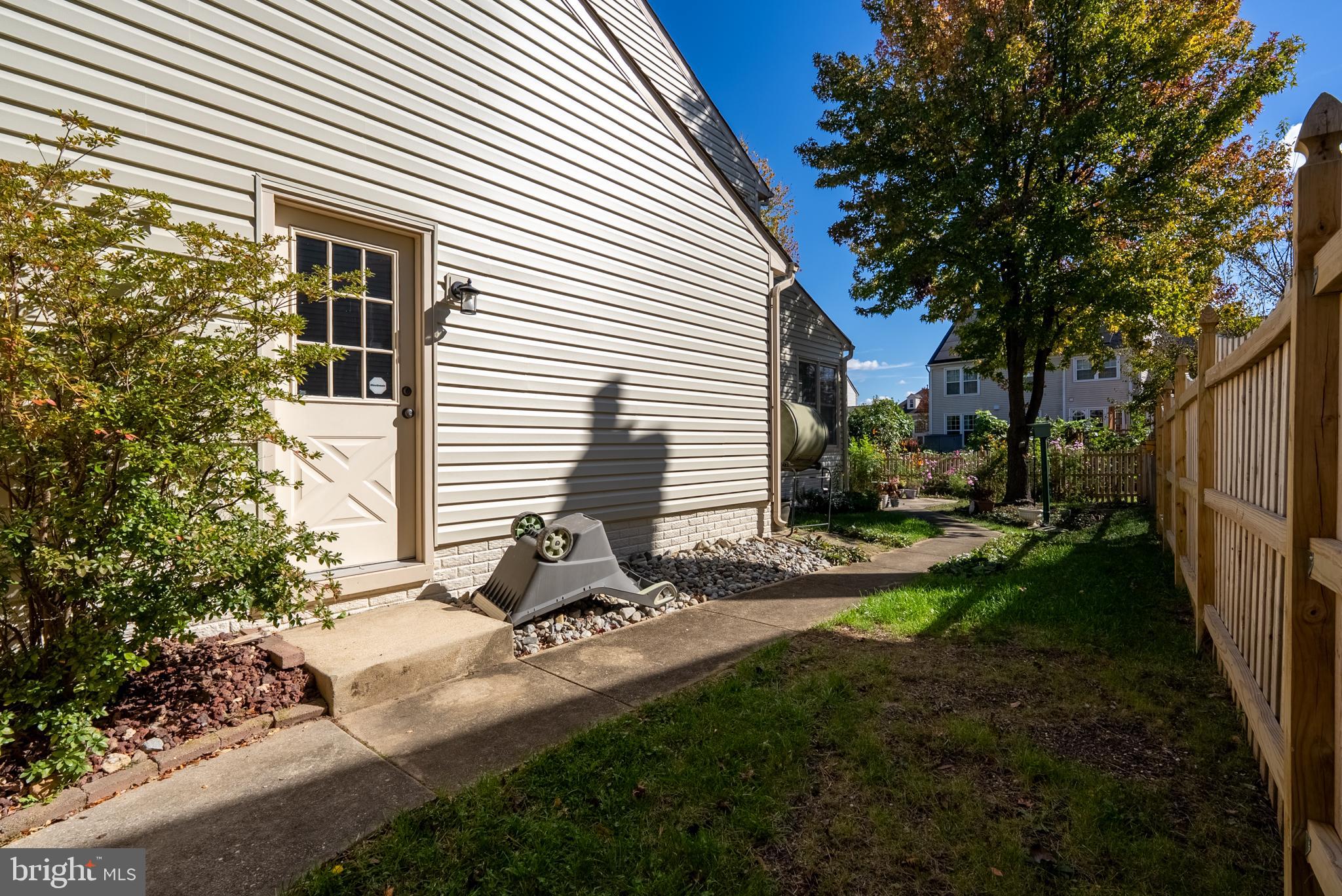 8007 Craddock Road Greenbelt, MD 20770 - Photo 52 of 59 Charming side yard with lush greenery.