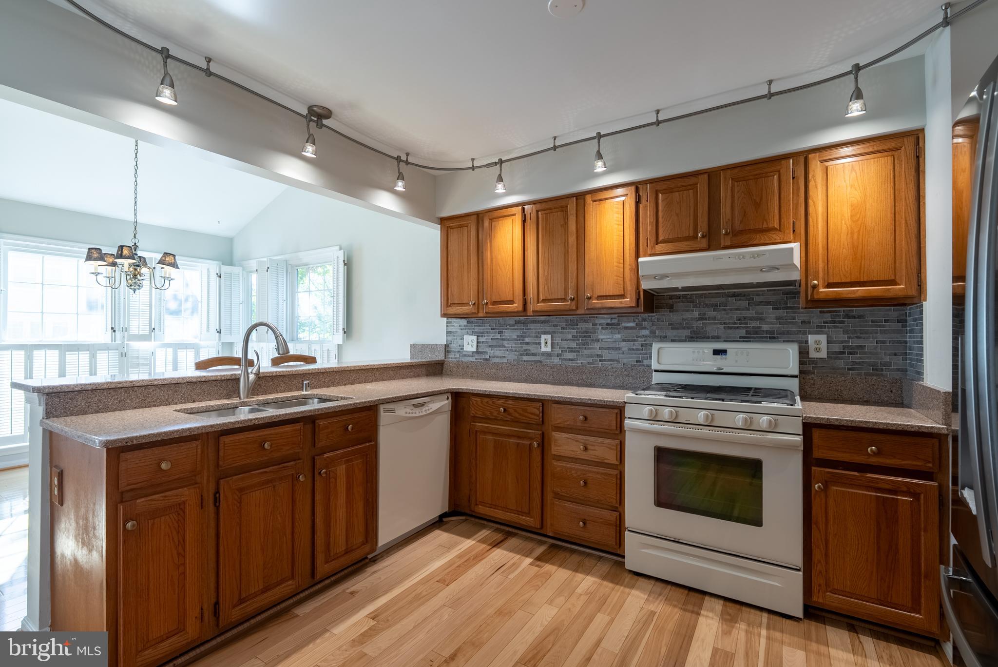 8007 Craddock Road Greenbelt, MD 20770 - Photo 10 of 59 Warm wood tones in a bright kitchen space.