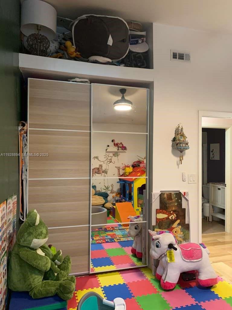 15228 Southwest 111th Street Miami, FL 33196 - Photo 14 of 27 a view of kids room with toys