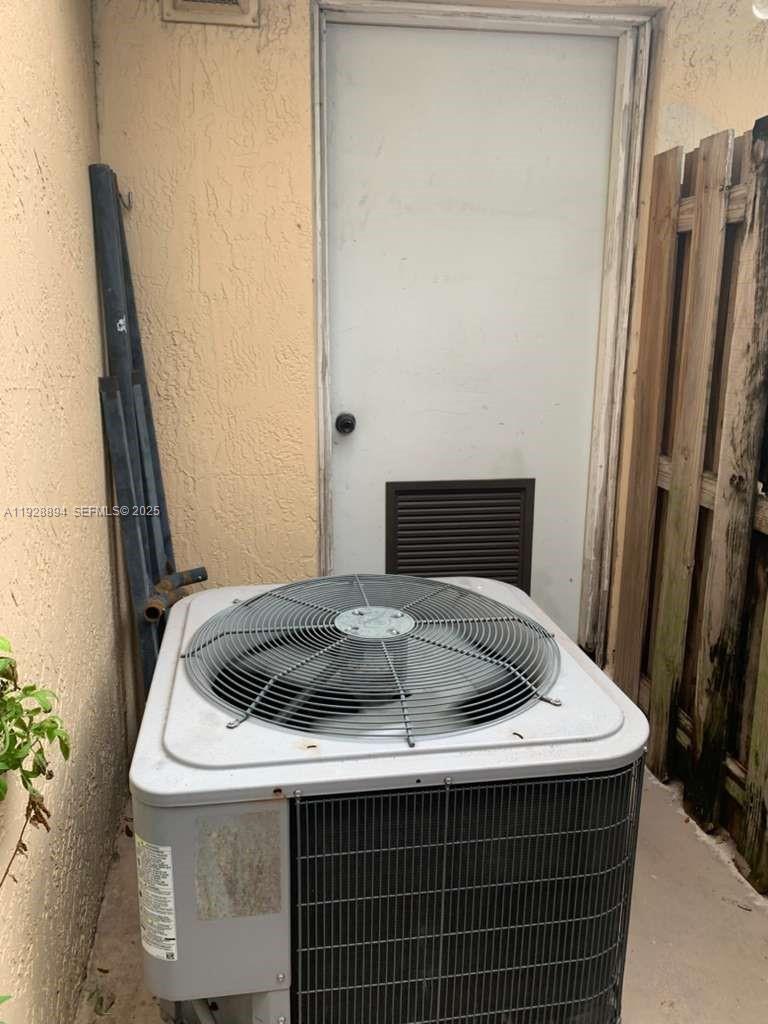 15228 Southwest 111th Street Miami, FL 33196 - Photo 22 of 27 a bathroom with a sink and a mirror