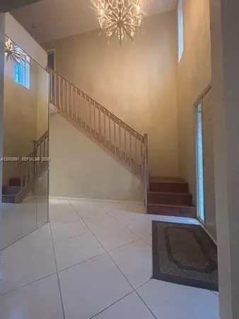 a view of a livingroom with staircase