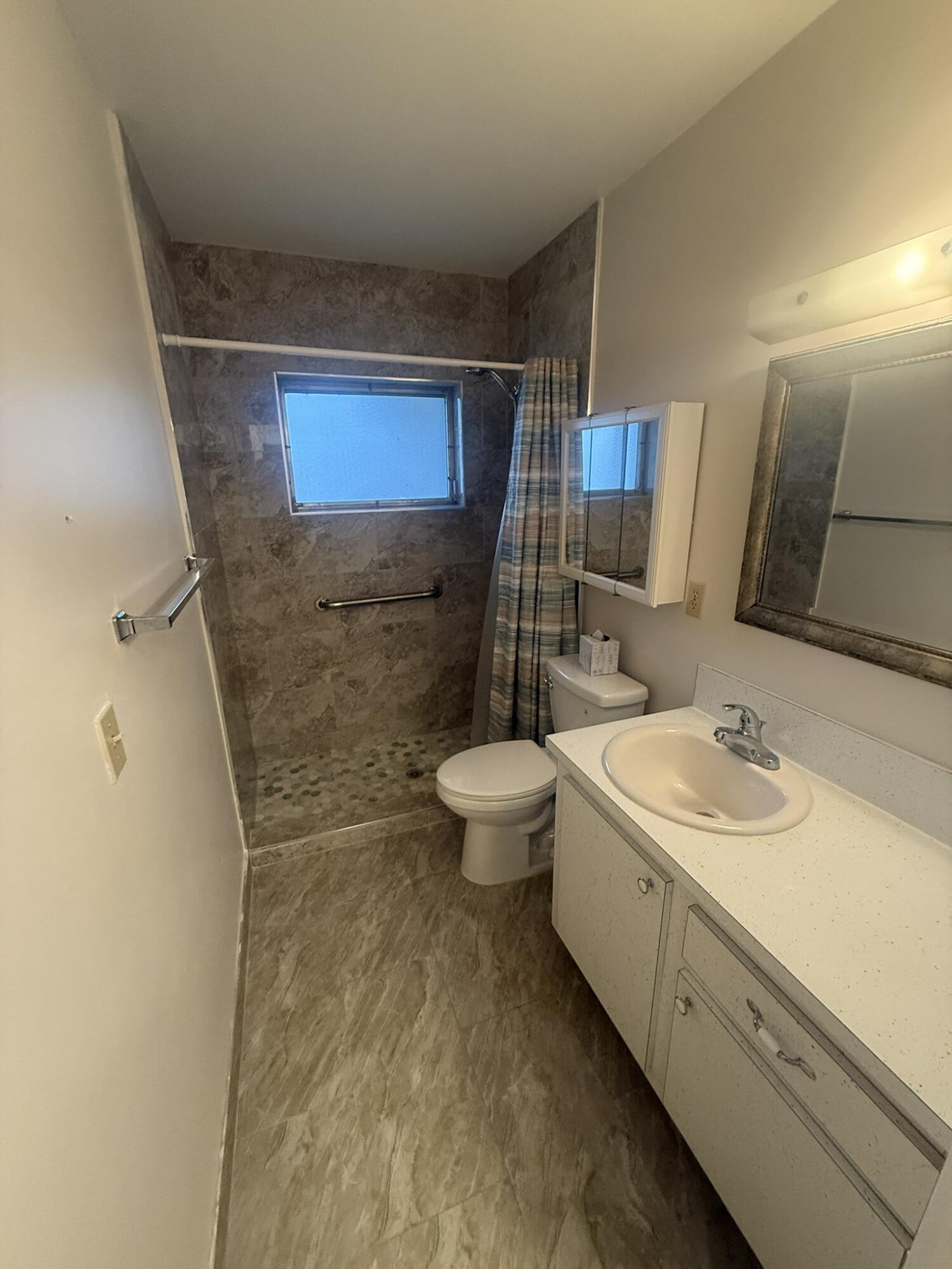 2509 Dudley C Drive West, Unit C West Palm Beach, FL 33415 - Photo 9 of 15 Primary Bathroom