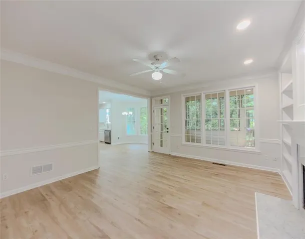 a spacious bathroom with a sink and a mirror