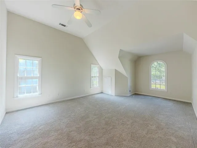 a white toilet sitting next to a window