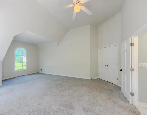 a bathroom with a glass shower door