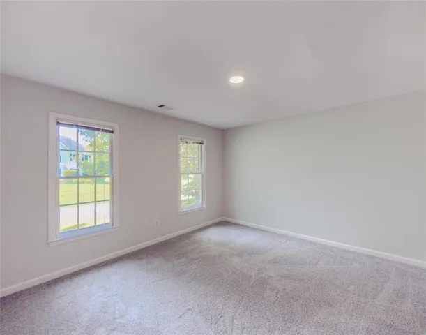 a bathroom with a sink double vanity and a mirror