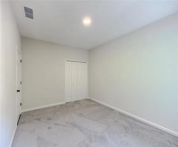 a view of a room with wooden walls