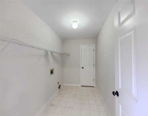 a roof deck with table and chairs under an umbrella