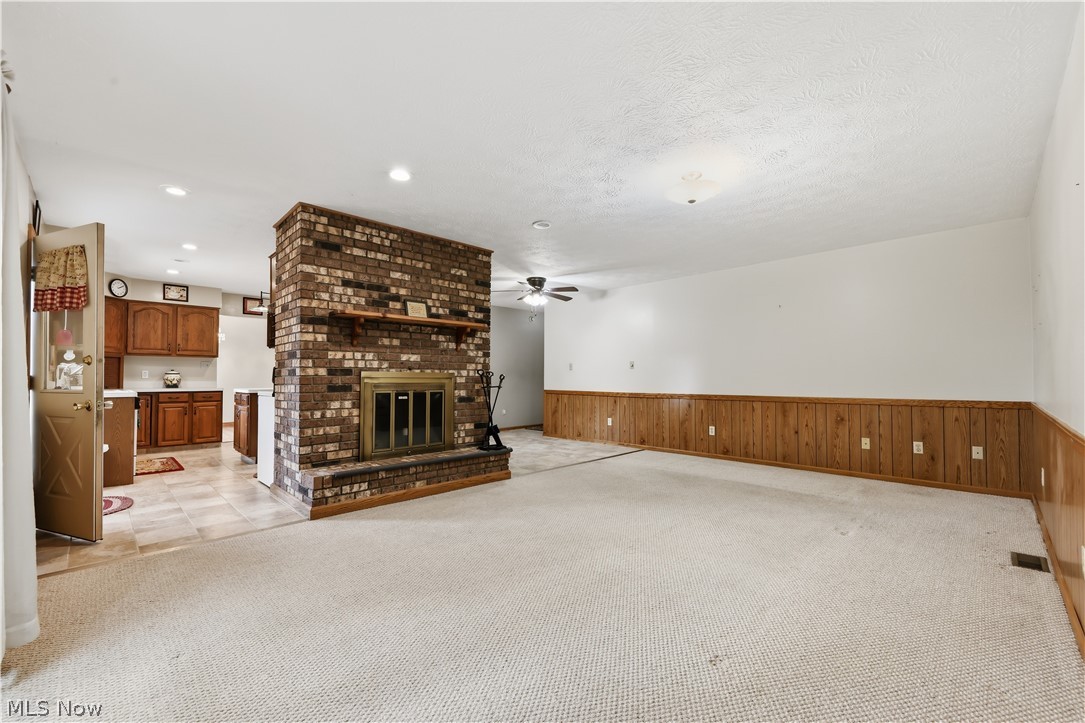 1835 Lynn Road Kent, OH 44240 - Photo 7 of 49 Brick fireplace with a wood mantel