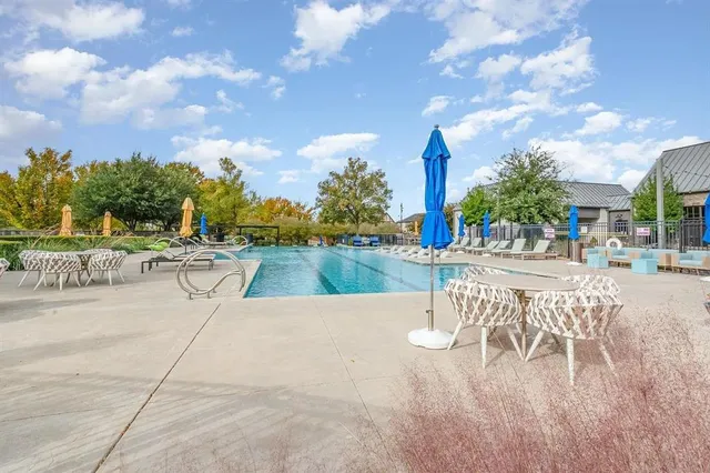 a view of a patio with swimming pool