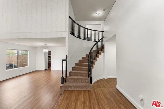 a view of entryway with wooden floor