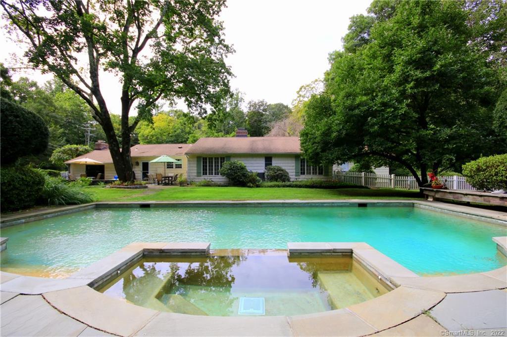 a view of a swimming pool with a patio