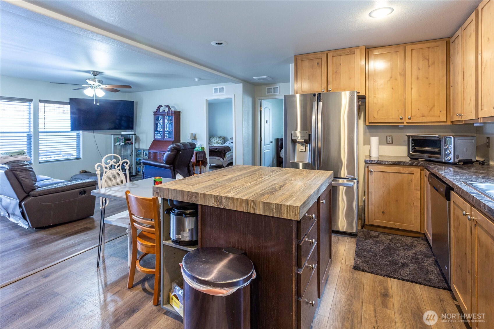 4550 Decatur Drive Ferndale, WA 98248 - Photo 11 of 22 a kitchen with stainless steel appliances granite countertop a kitchen island a stove a table and chairs