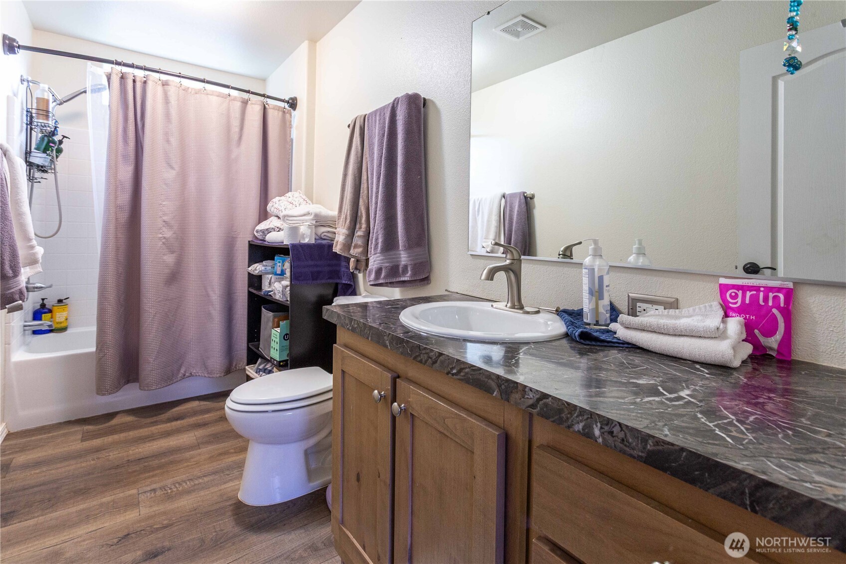 4550 Decatur Drive Ferndale, WA 98248 - Photo 16 of 22 a bathroom with a granite countertop sink a toilet and a shower