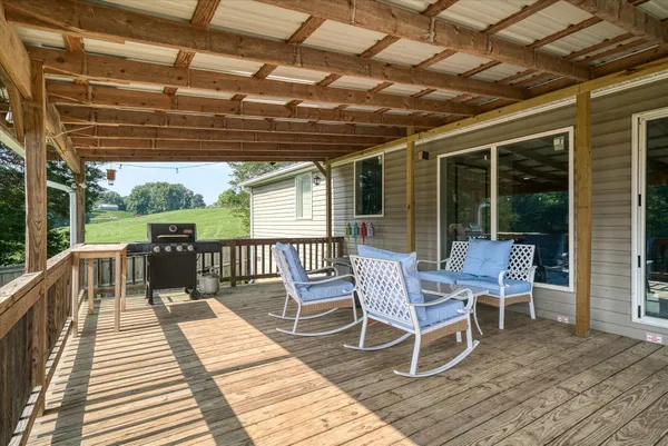 a view of a chairs on wooden deck