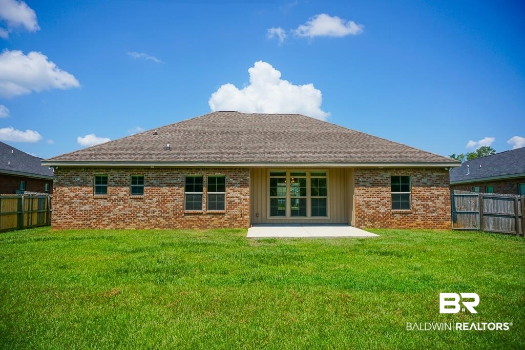 593 Begeman Road Mobile, AL 36608 - Photo 23 of 23 Back of house featuring a patio area and a yard