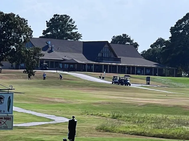 a view of a house with swimming pool and yard