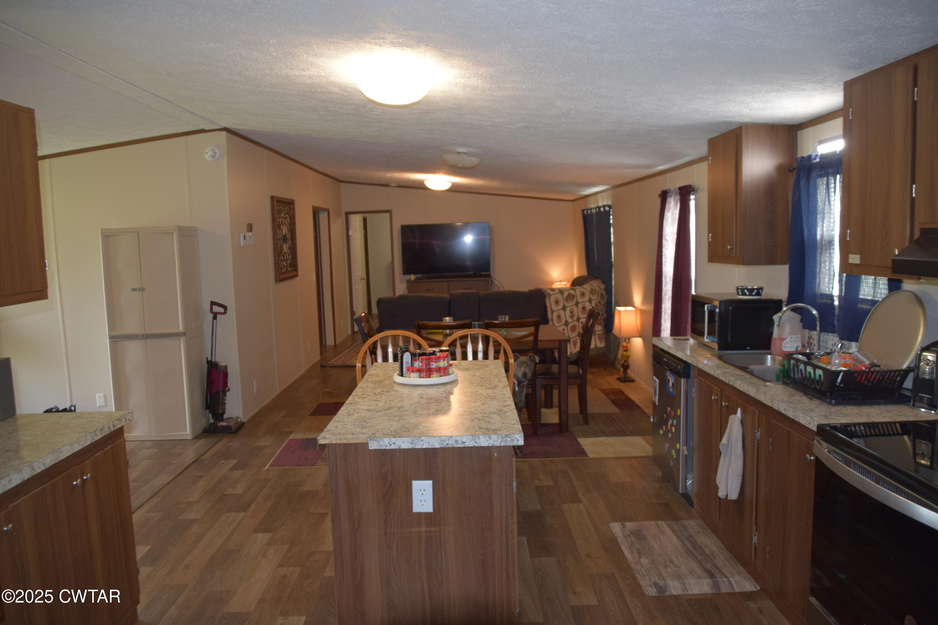 285 Pete Tinsley Road Alamo, TN 38001 - Photo 12 of 27 a kitchen with stainless steel appliances granite countertop a stove and a sink