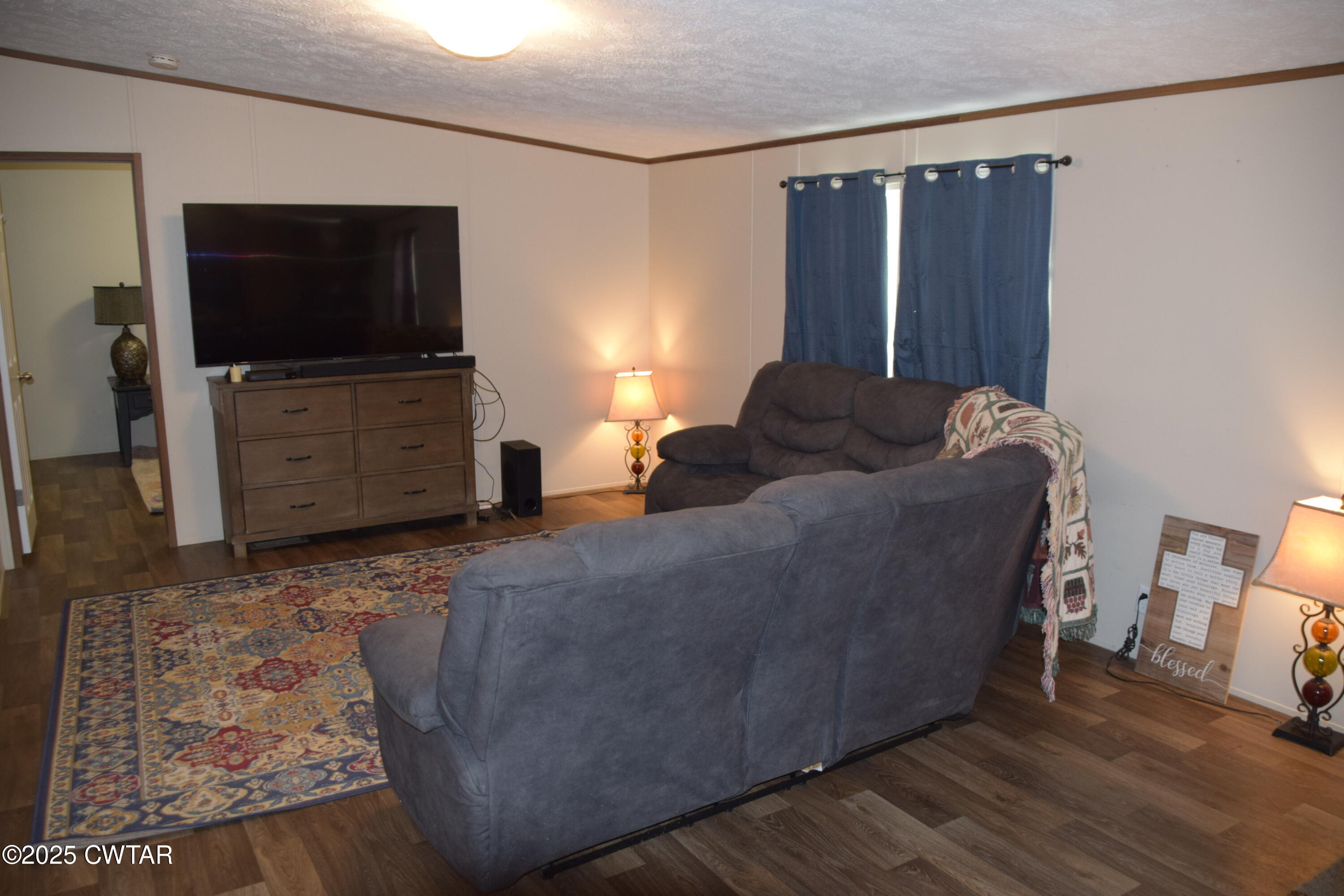 285 Pete Tinsley Road Alamo, TN 38001 - Photo 16 of 27 a living room with furniture and a flat screen tv