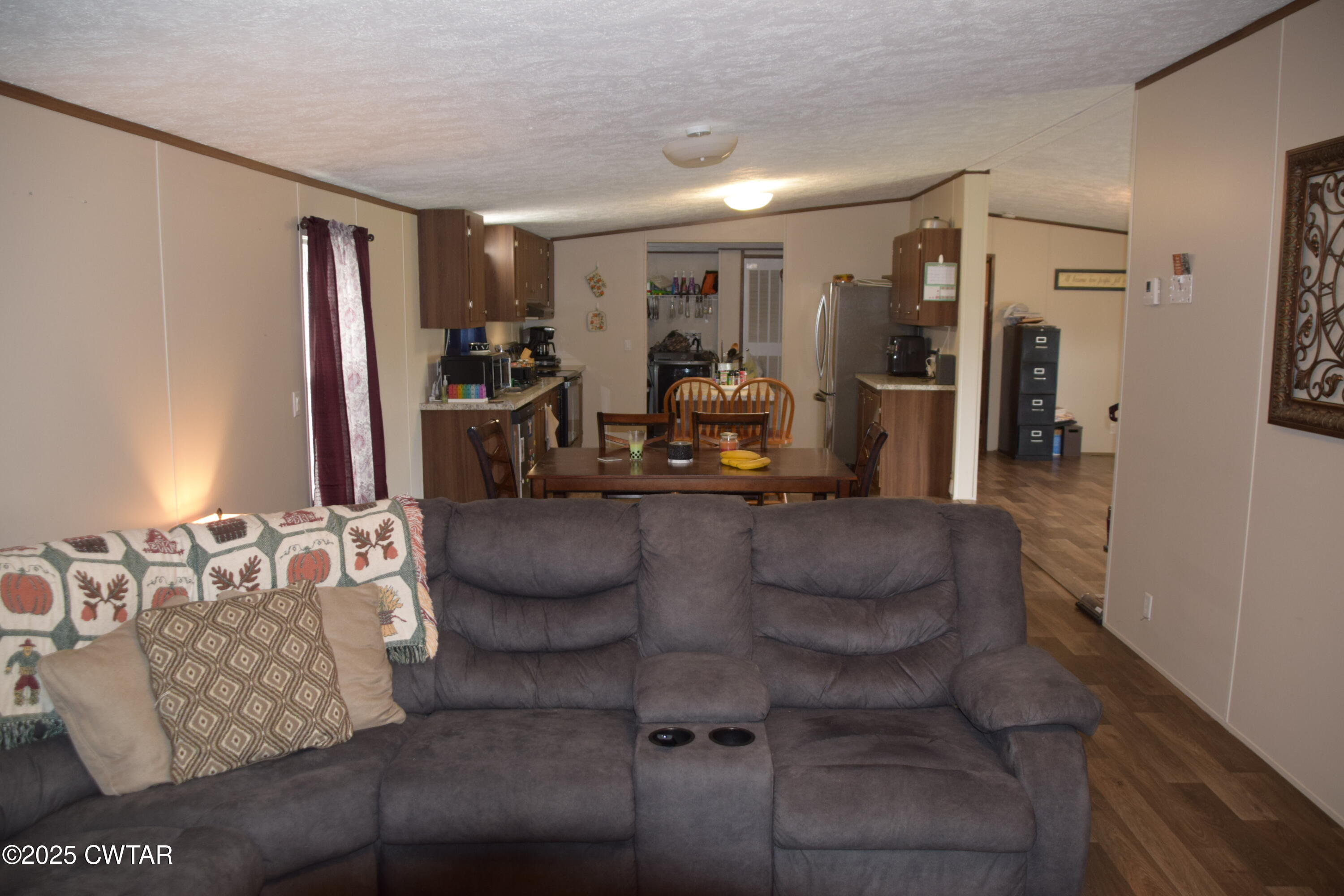 285 Pete Tinsley Road Alamo, TN 38001 - Photo 18 of 27 a living room with furniture a mirror and gym equipment