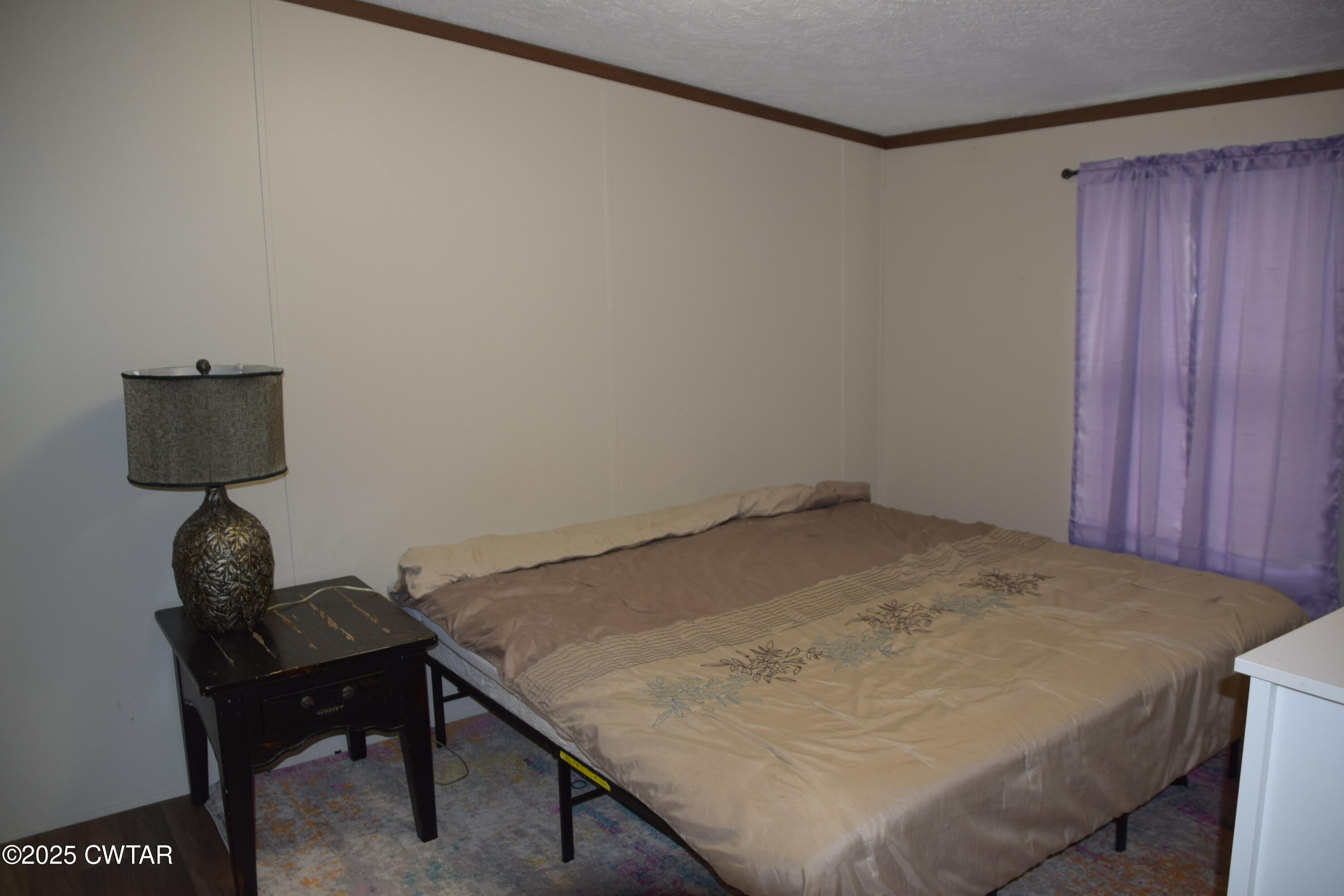 285 Pete Tinsley Road Alamo, TN 38001 - Photo 19 of 27 a room with furniture and wooden floor