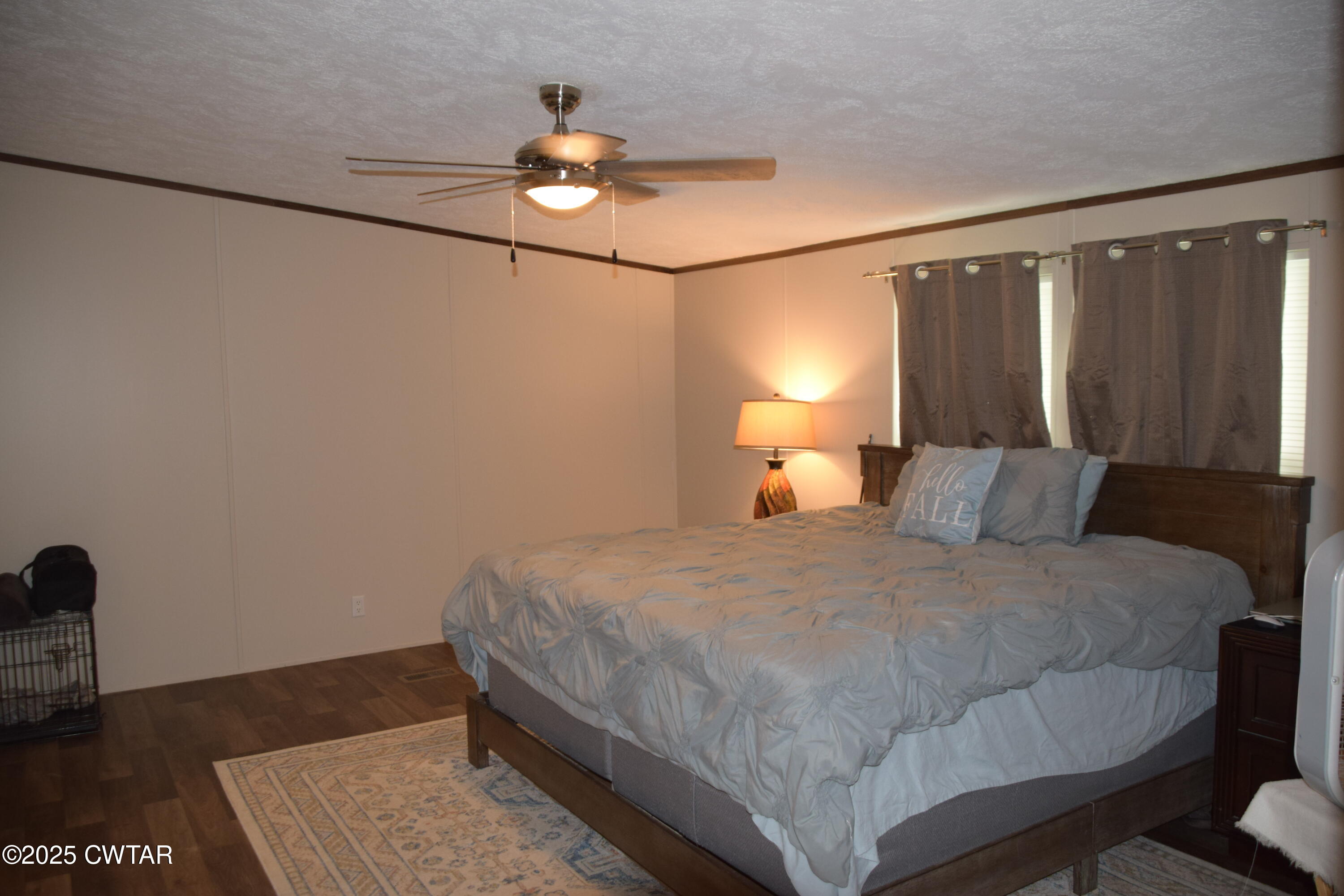 285 Pete Tinsley Road Alamo, TN 38001 - Photo 23 of 27 a bedroom with a bed and wooden floor