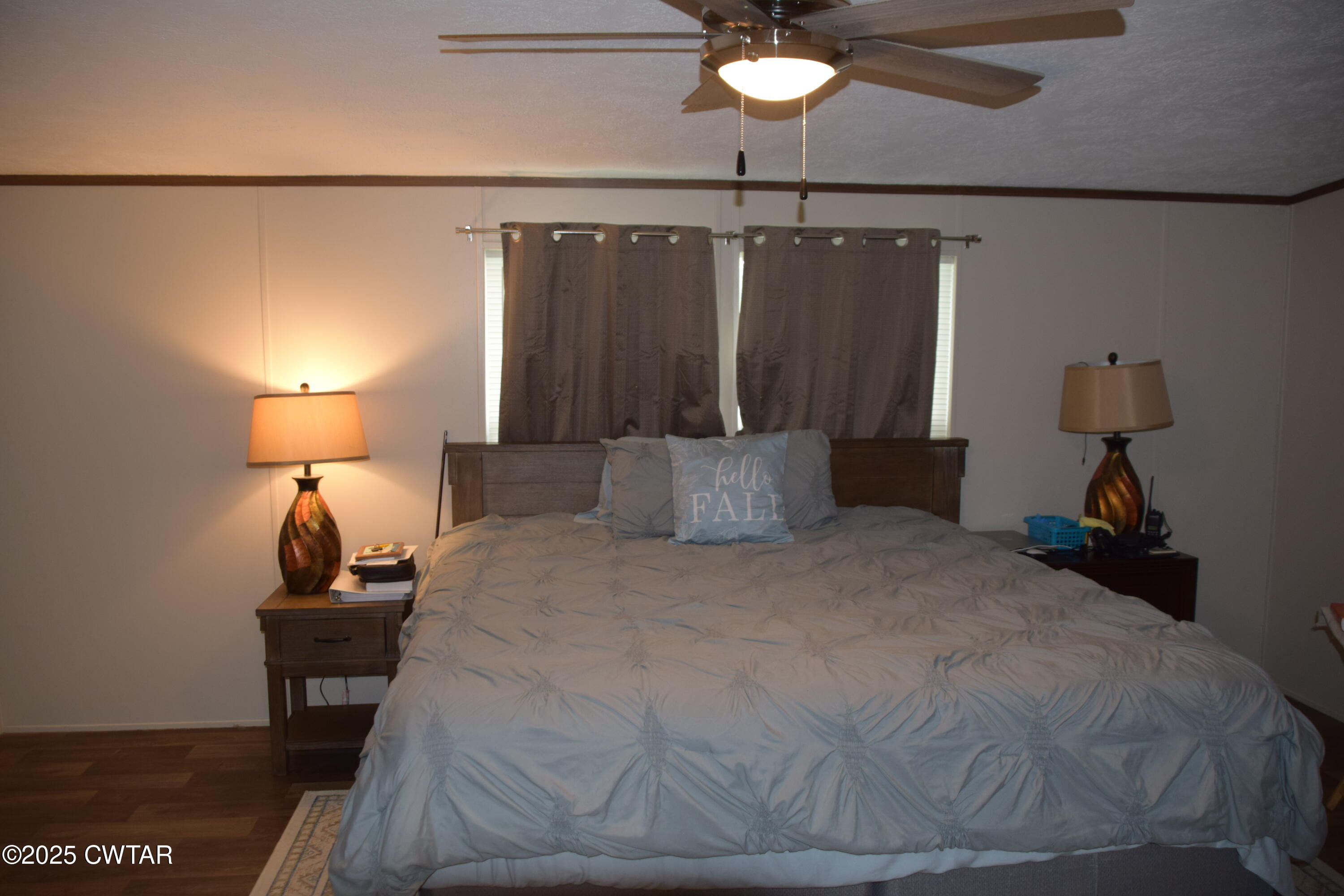 285 Pete Tinsley Road Alamo, TN 38001 - Photo 25 of 27 a large bed sitting in a bedroom next to a lamp