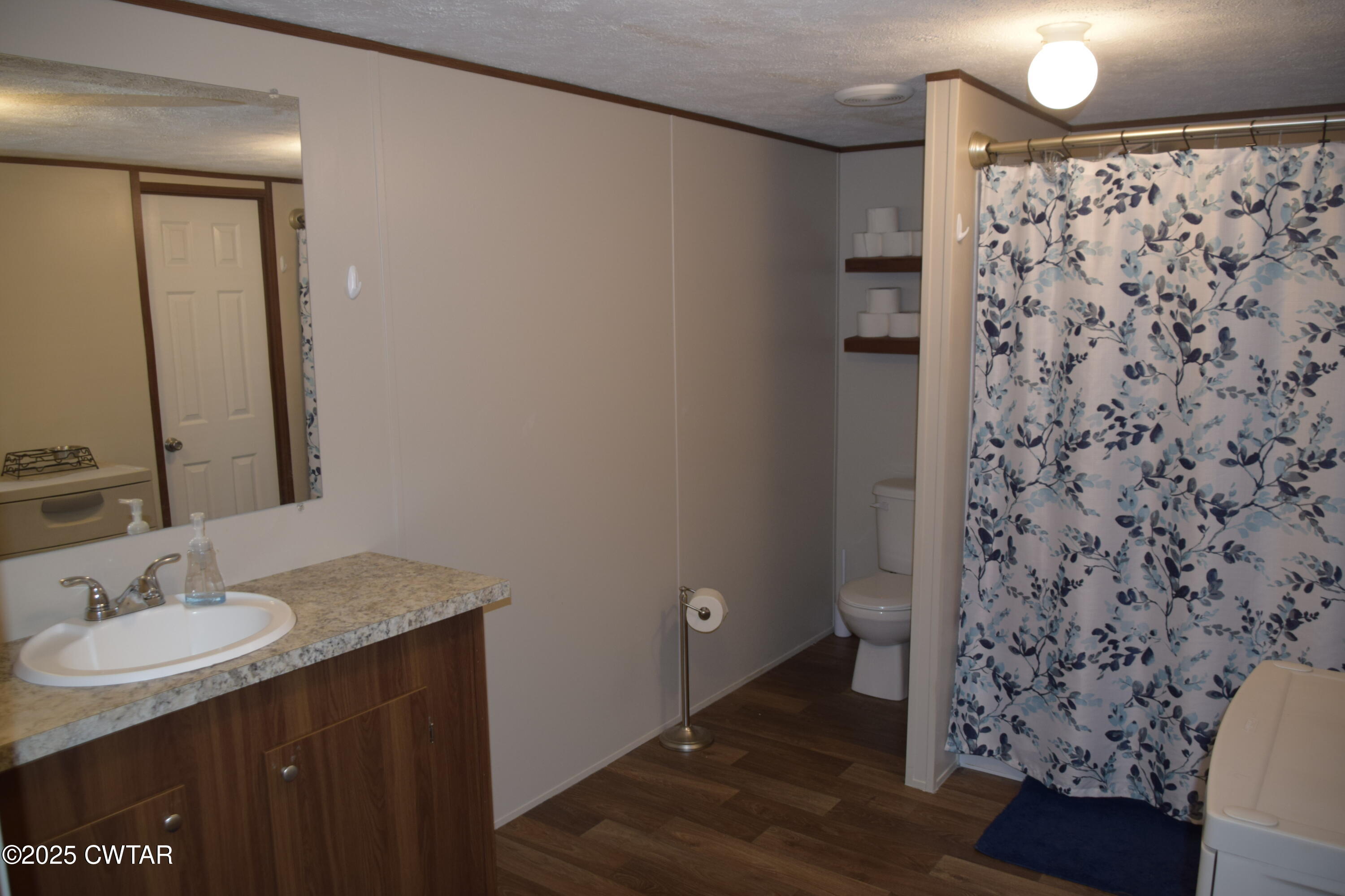 285 Pete Tinsley Road Alamo, TN 38001 - Photo 26 of 27 a bathroom with a sink and a mirror
