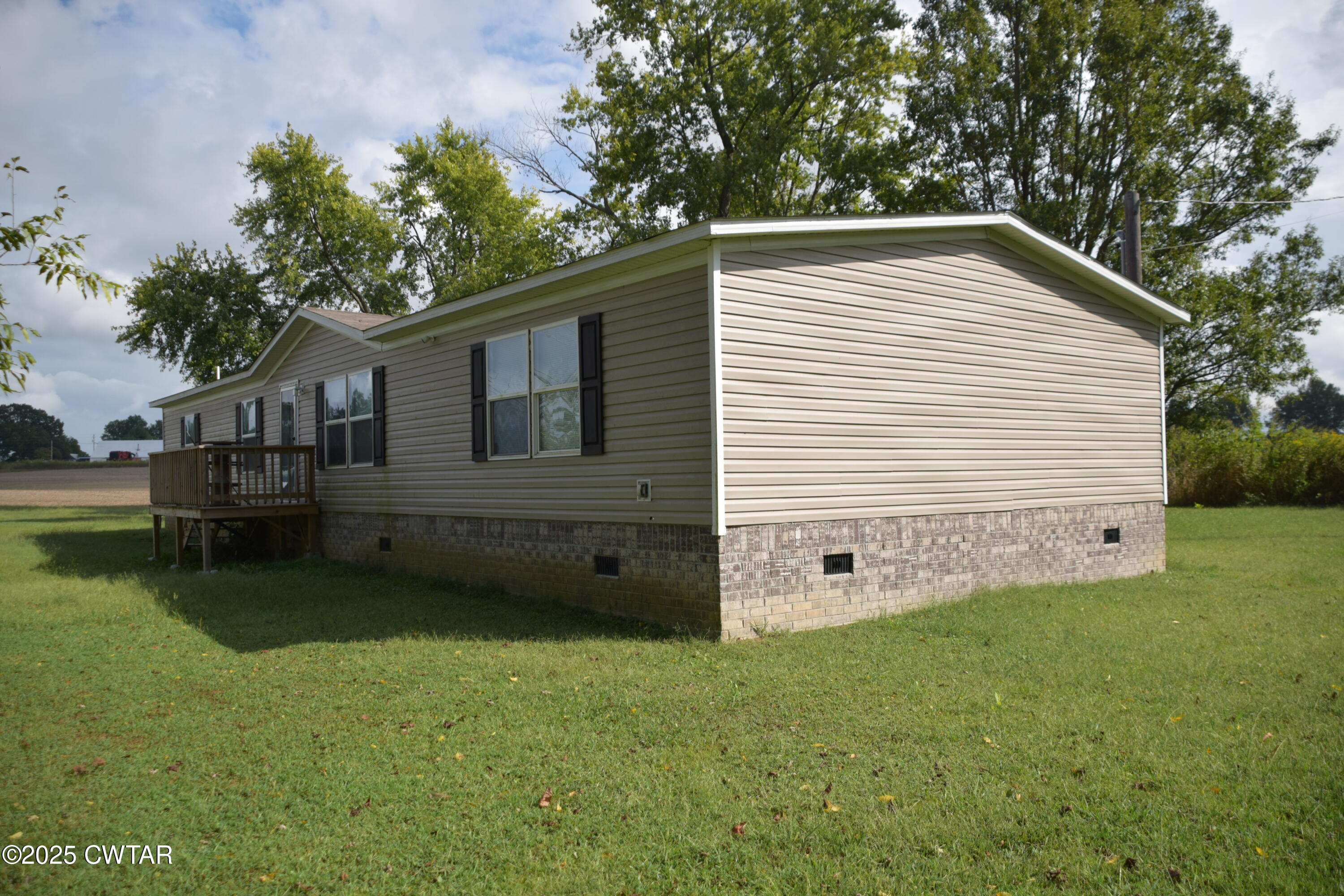 285 Pete Tinsley Road Alamo, TN 38001 - Photo 7 of 27 a view of a backyard with a garden