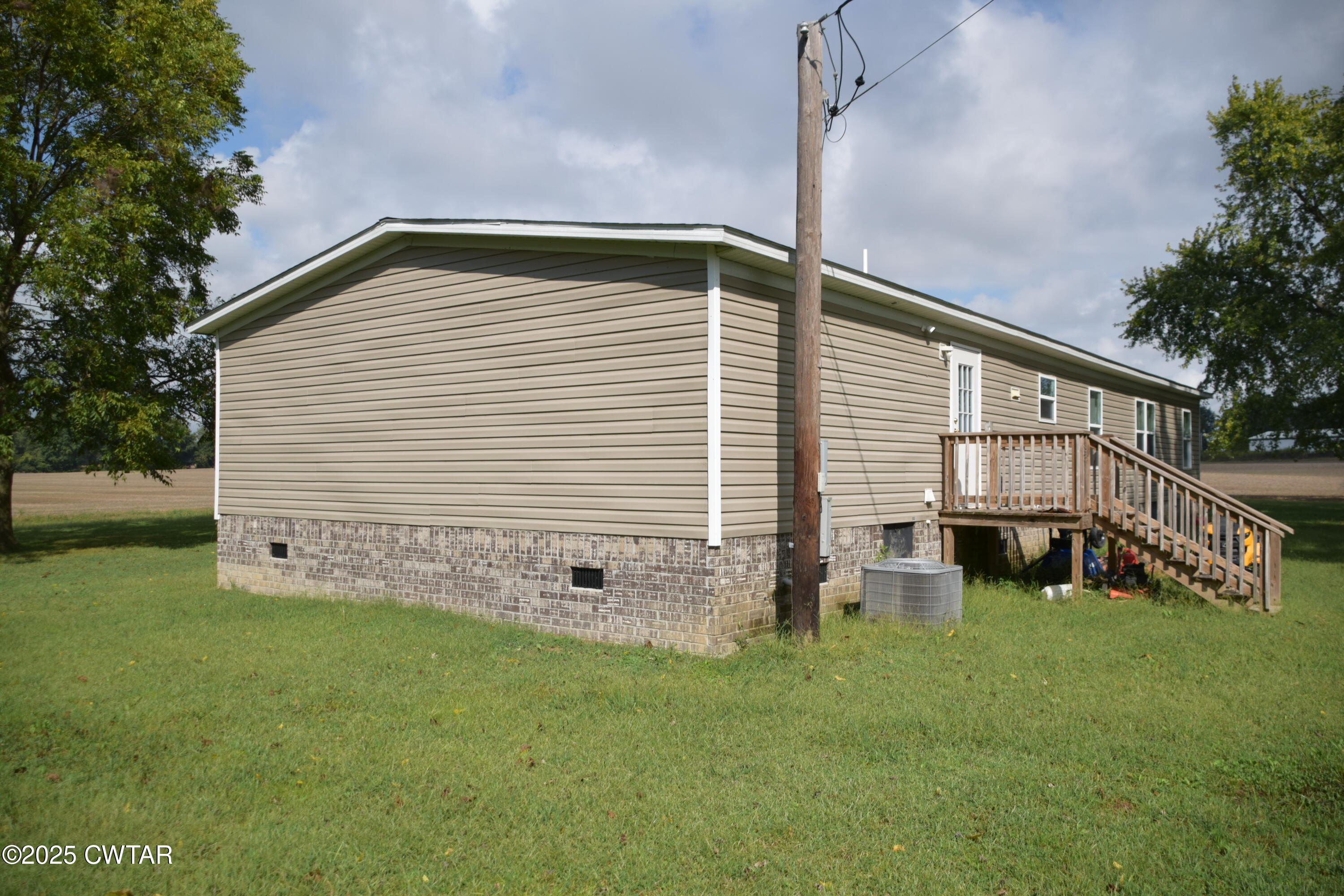 285 Pete Tinsley Road Alamo, TN 38001 - Photo 8 of 27 a backyard of a house with table and chairs