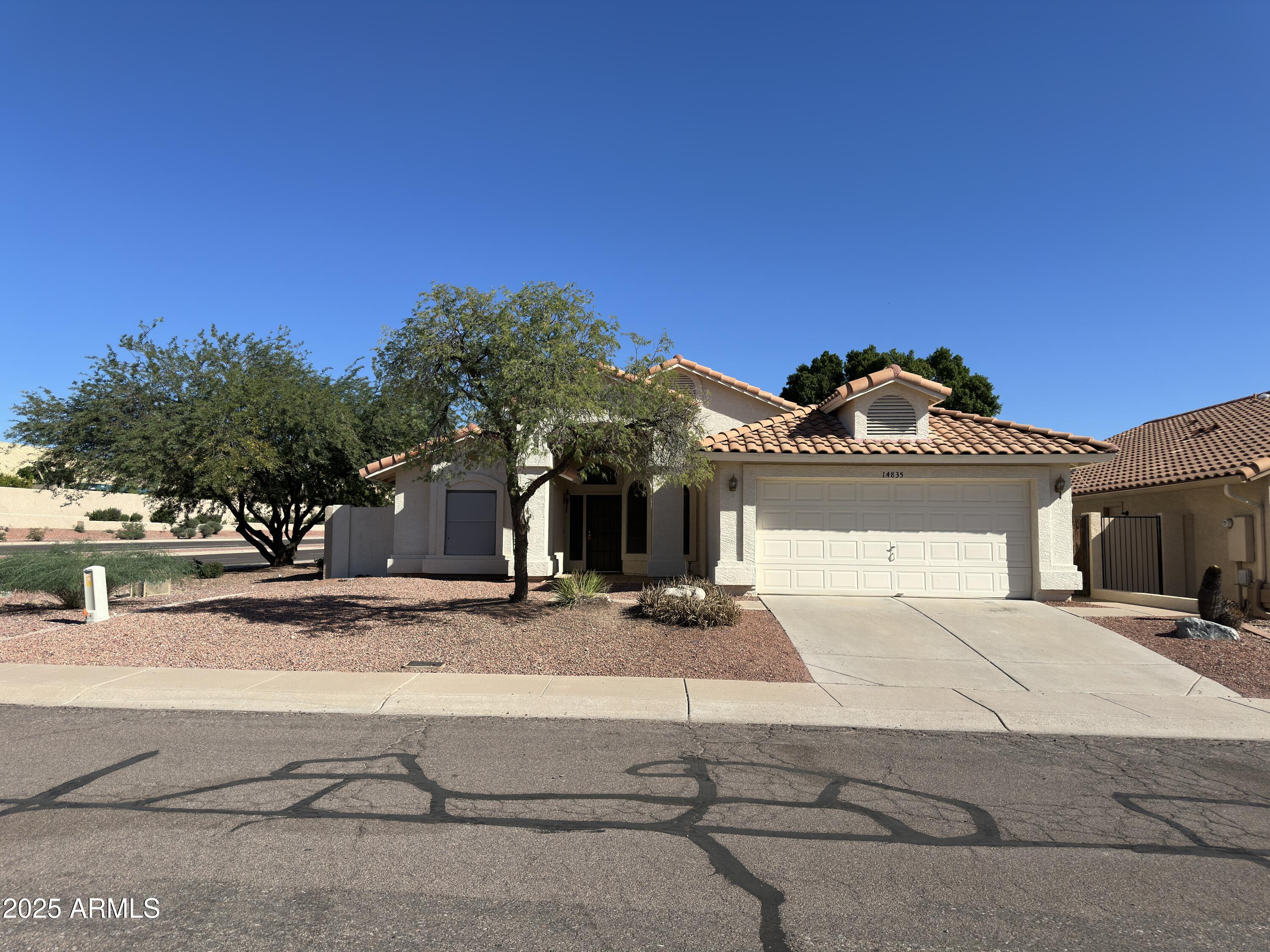 14835 South 26th Way Phoenix, AZ 85048 - Photo 1 of 13 a front view of a house with a yard