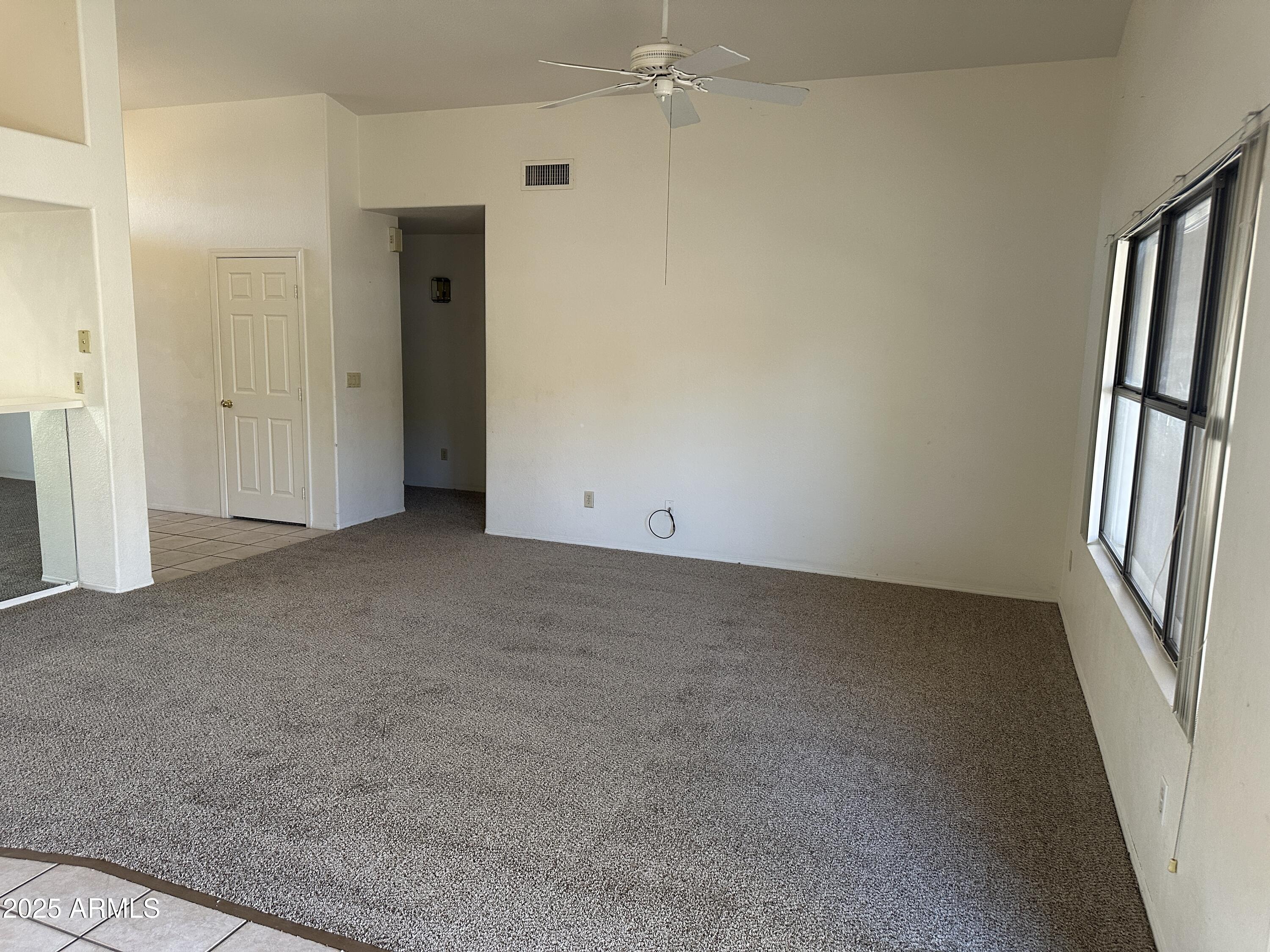 14835 South 26th Way Phoenix, AZ 85048 - Photo 5 of 13 an empty room with windows