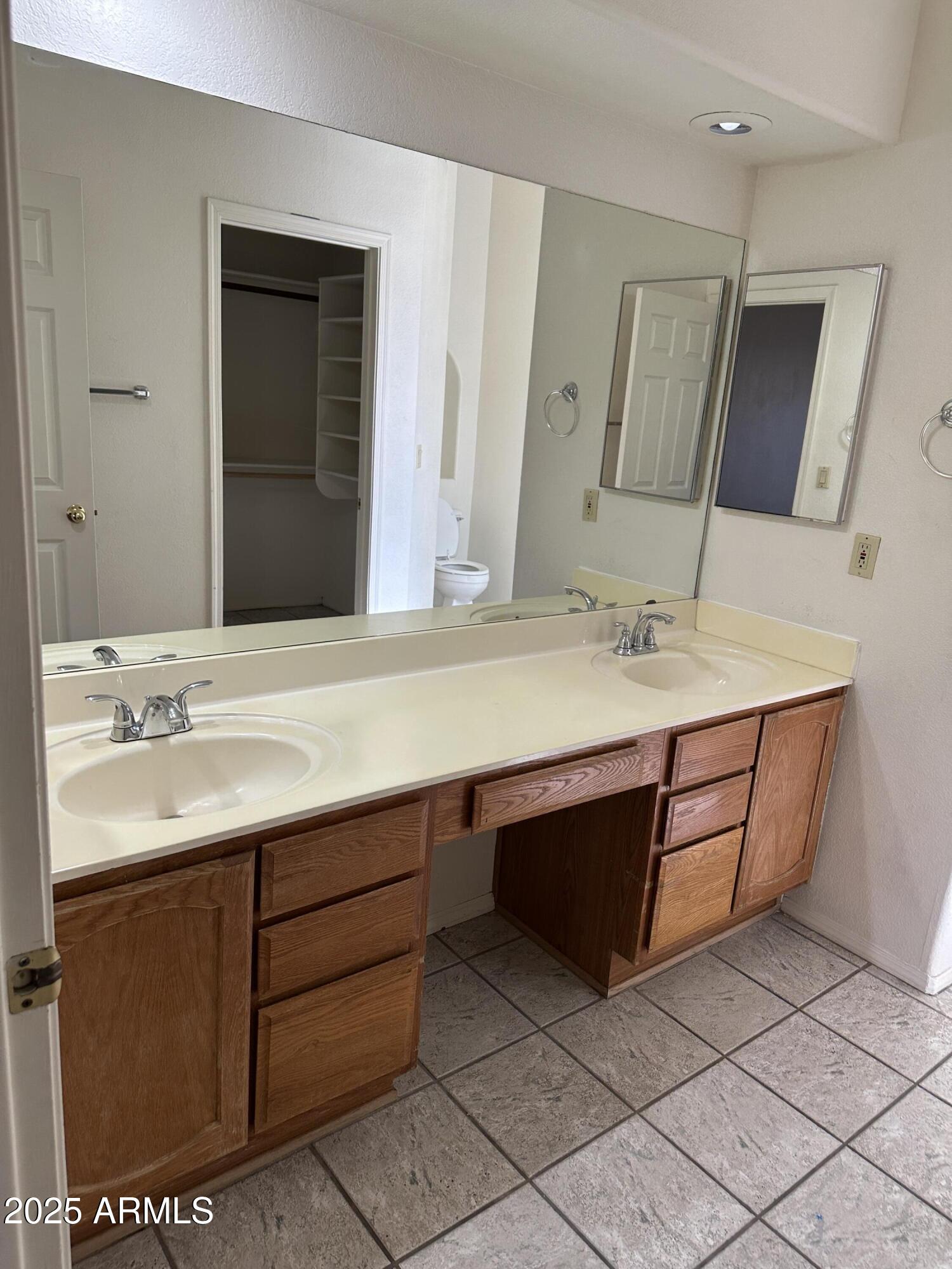 14835 South 26th Way Phoenix, AZ 85048 - Photo 7 of 13 a bathroom with a sink double vanity and a mirror