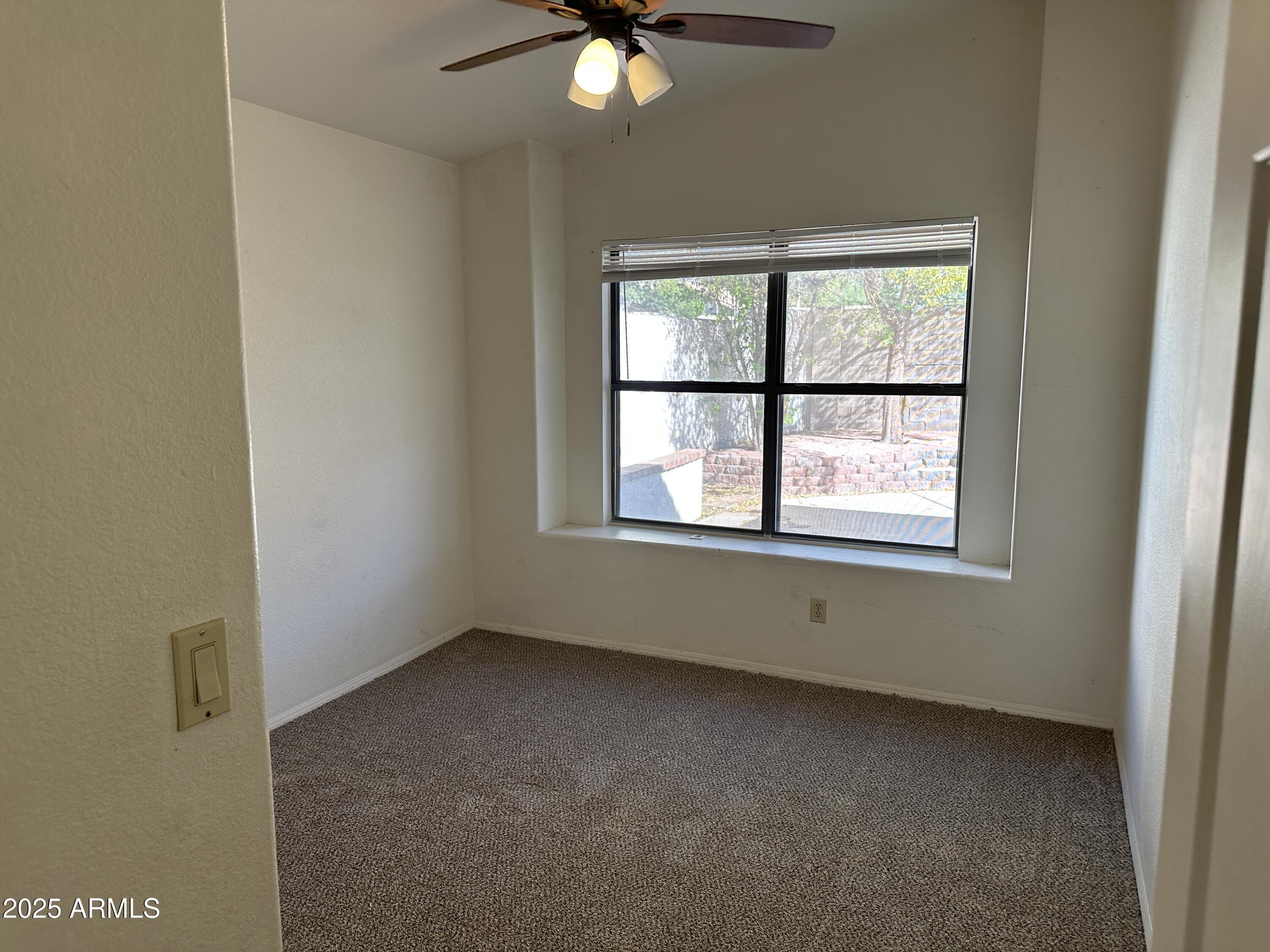 14835 South 26th Way Phoenix, AZ 85048 - Photo 9 of 13 an empty room with a window