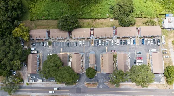 an aerial view of a house with outdoor space