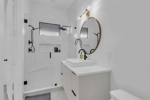 a large white bed in a white room