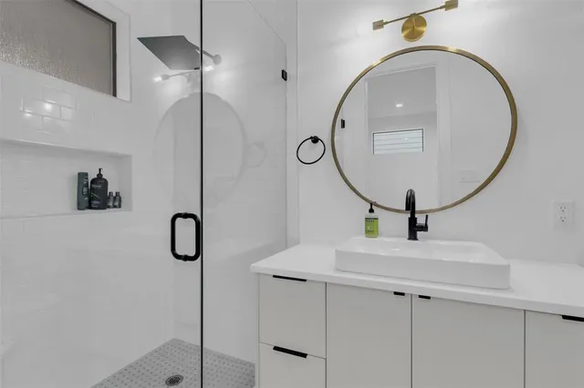 a bathroom with a sink toilet and shower