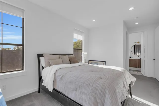 a bed room with a bed and a window