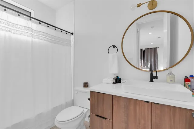 a bedroom with a bed and a lamp